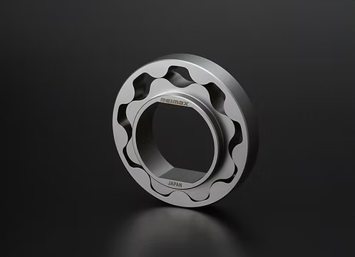 A metallic bicycle headset shell with a silver finish, featuring the 'remax' brand name and 'JAPAN' text, set against a dark reflective studio background.