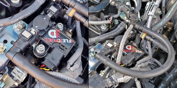 Close-up of automotive wiring harness with a brand logo on a metallic background