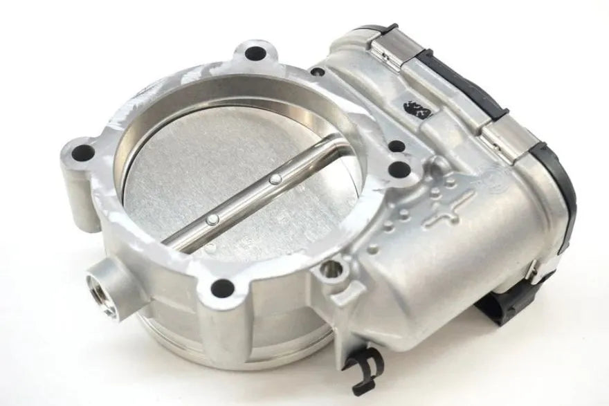 Mechanical throttle body on a white background