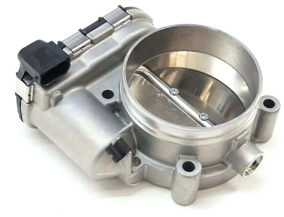 Metallic throttle body on a white background