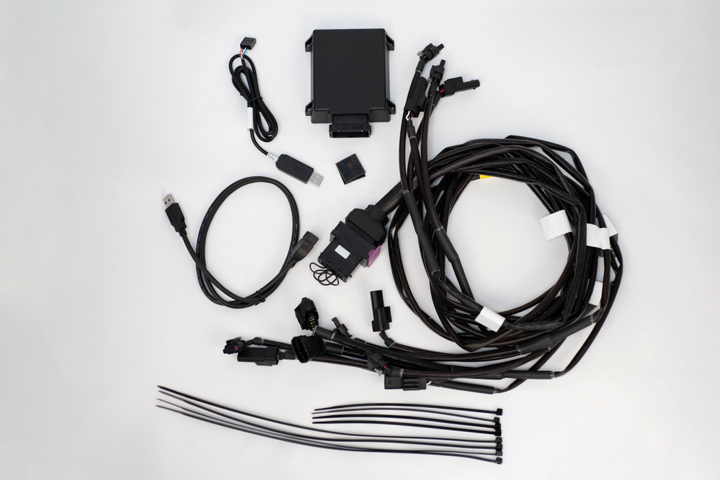 Car wiring harness kit on a white background Fabspeed Ferrari 296 OPF Monitor