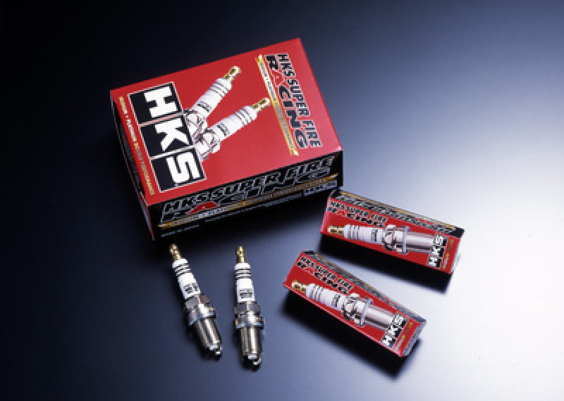 A set of HKS spark plugs for a Lancer Evolution GSR/MR M-Series, displayed alongside their packaging.