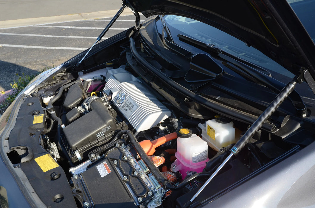 Car engine compartment with various components visible