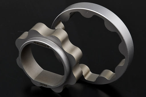 Two metallic bicycle chain guard plates, one with a hexagonal end and the other as a flat ring, both featuring a scalloped inner edge. The brand name 'Rimex' is visible on the hexagonal end, and 'JAPAN' is printed near the bottom.