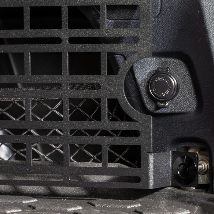 subaru outback molle panel installed in rear cargo storage area closeup of cutout for 12v accessory plug
